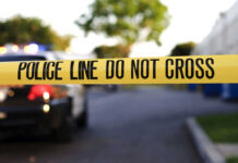 Yellow police tape with text police line do not cross