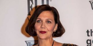 A woman with a bob haircut wearing a sequined dress at a red carpet event