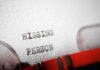Close-up of a typewritten document stating 'MISSING PERSON'