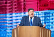 A government official delivering a speech at a conference