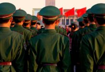Group of uniformed soldiers standing in formation during a ceremony