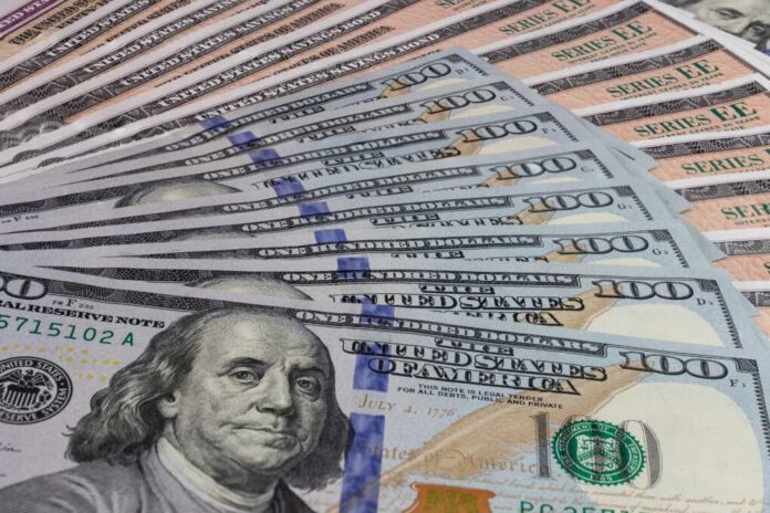 Dollar bills_2106795518.jpg A close-up view of a stack of hundred dollar bills arranged neatly