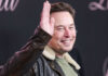 Musk’s AI Leadership Shaken – Founders Flee Man in leather jacket smiling and waving