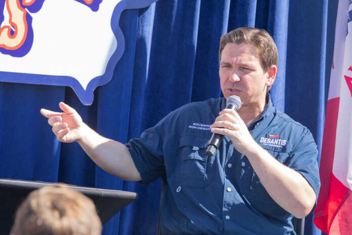 Person speaking into microphone during public event