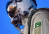 Pakistani Jets DEPLOY to Saudi Arabia—Nuclear Alliance ACTIVATED Close-up of a military pilot wearing a helmet and a uniform with a Pakistan flag patch
