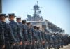 Trump Orders BLOCKADE — World Oil Chokes Navy personnel marching in formation towards a ship