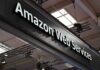 Sign displaying Amazon Web Services at a trade show