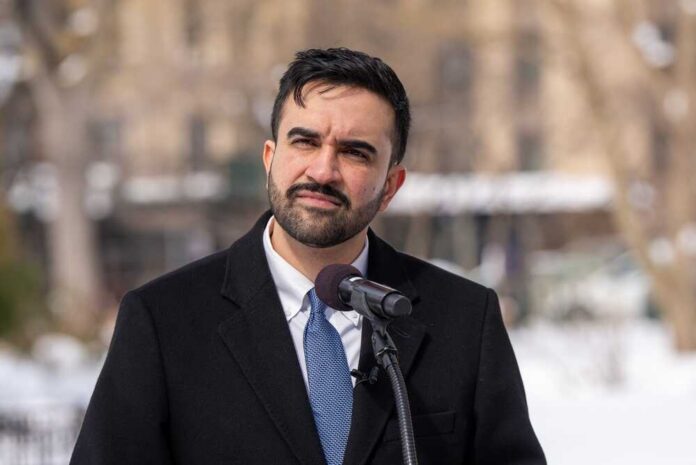 shutterstock_2743706211.jpg Individual speaking at a podium in a winter outdoor setting