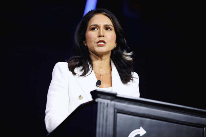 Person speaking at a podium with microphone.