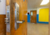 Progressive City, Pricier Chancellor—Guess Who Pays Door opening into an empty classroom.