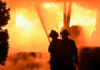 Firefighters battling intense blaze at night scene
