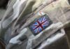 Close-up of a military uniform with a British flag patch