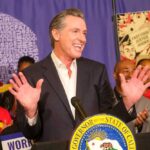 California governor speaking at a public event with supporters