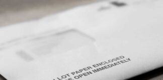 Vote-by-mail envelopes with U.S. flag design