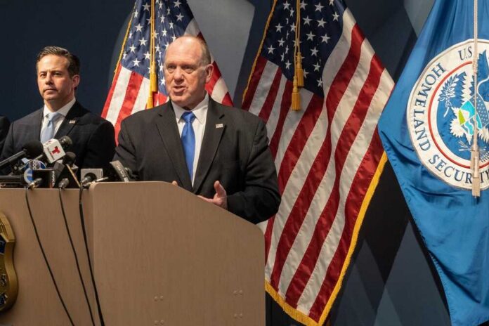 New,York,,Ny,-,April,22,,2025:,Tom,Homan,,'border Government officials speaking at a press conference with U.S. flags in the background