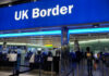 UK border entry with barriers and signs