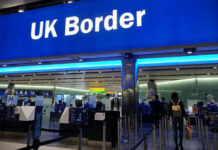 UK border entry with barriers and signs