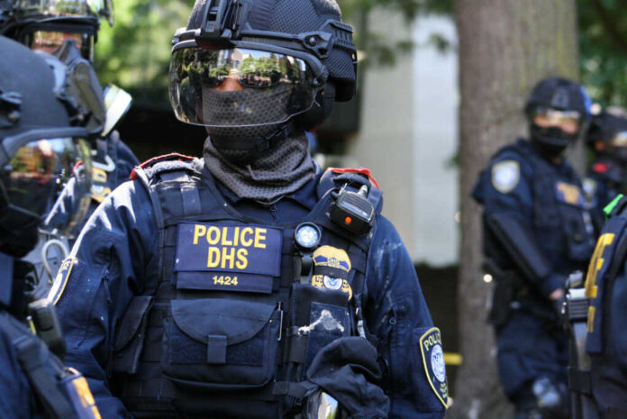 federal-police-from-the-department-of-homeland-security1801253857jpg Riot police officer in tactical gear with helmet and visor