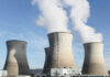 Cooling towers at a power plant releasing steam