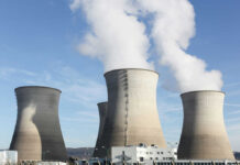 CEO Pitches Nuke-Powered Data Hubs Next Door—What Could Go Wrong? Cooling towers at a power plant releasing steam