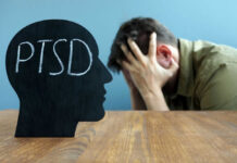 Silhouette with PTSD text, distressed man in background.