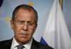 Man in suit with Russian flag backdrop