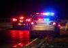Deadly Stop Sparks New Courtyard Rules Police car with flashing lights parked on the roadside at night