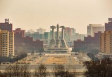 Unproven Nuke Warship? Kim Dares Rivals View of a large monument surrounded by buildings in Pyongyang