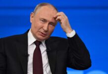 Putin’s Strongman Image Cracks A political leader appearing thoughtful during a press conference