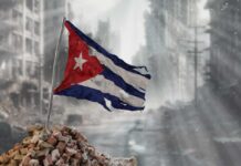 Bejucal Antennas Activate—Targets Closer Than You Think Worn Cuban flag standing on rubble in a desolate urban environment