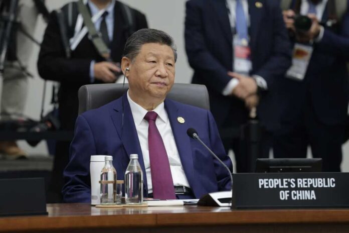 Gyeongju,,Korea,-,October,1,2025:,President,Of,The,People's Senior official in a blue suit sits at an international conference table