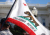 California Costs Explode — Runoff Shock California state flag being held up at an outdoor event