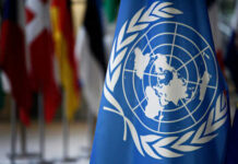 Taxpayer Alert: Lebanon Tab Balloons Fast United Nations flag with other flags in background