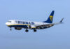 Ryanair Window Blows—Man Nearly Sucked Out Passenger plane in flight under clear blue sky