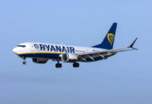 Ryanair Window Blows—Man Nearly Sucked Out Passenger plane in flight under clear blue sky