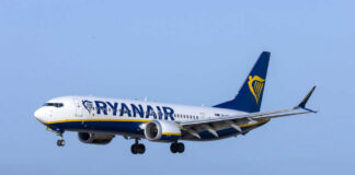 Passenger plane in flight under clear blue sky