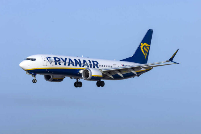 Passenger plane in flight under clear blue sky