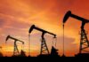 oil pumpjacks silhouetted at sunset