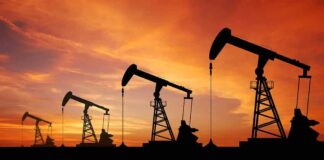 oil pumpjacks silhouetted at sunset
