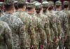 Hypersonic Gamble: Trump’s $12B Headache Soldiers in camouflage uniforms standing in formation from behind