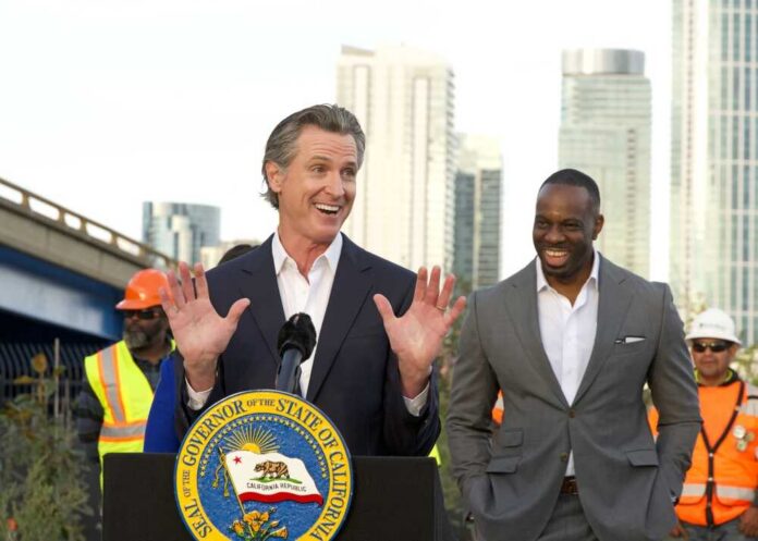 San,Francisco,,Ca,-,Nov,9,,2023:,Governor,Gavin,Newsom California governor speaking at a construction site with smiling attendees