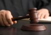 America’s Edge Hijacked—Where’s The Punishment? A judge's hand holding a gavel above a wooden block