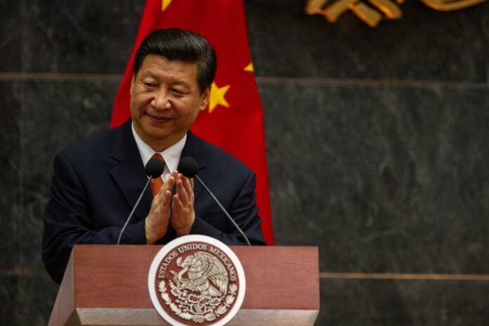 A political leader giving a speech and applauding