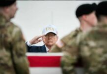 America’s GPS Vulnerable — Enemies Smell Blood A man in a USA hat saluting during a military ceremony