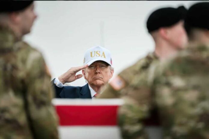 Delaware,,Dover,Airforce,Base.,2026,March,7.,President,Donald,Trump A man in a USA hat saluting during a military ceremony