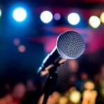 Process Excuse Kills Hasan Piker Talk Microphone on stage under colorful lights