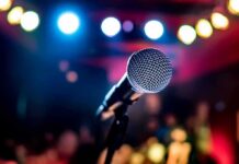 Microphone on stage under colorful lights
