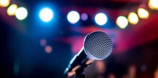 Microphone on stage under colorful lights