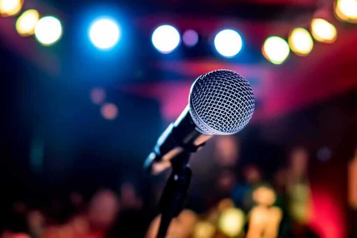 Microphone on stage under colorful lights
