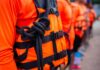 Deadly Blaze — Rescue Race In Rough Seas Life jacket with rope knot in a line of people